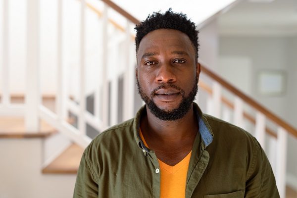 Portrait of african american man looking at camera. lifestyle, leisure and spending time at home.