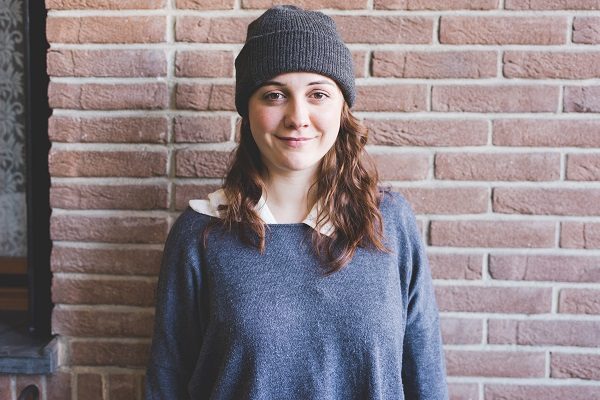 waist up beautiful young woman looking camera smiling